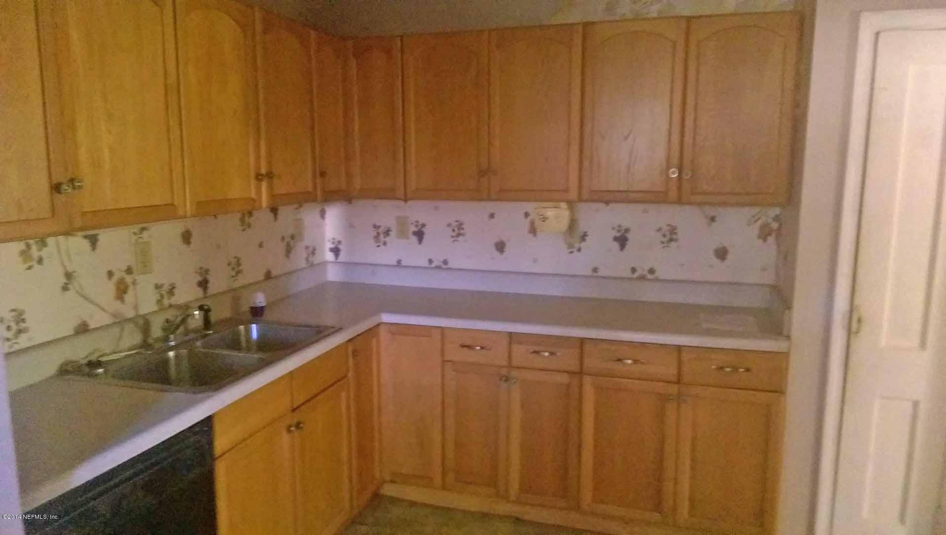 1795 Lilly Road East Jacksonville, FL 32207 - Photo 5 of 12 a view of a sink and cabinets