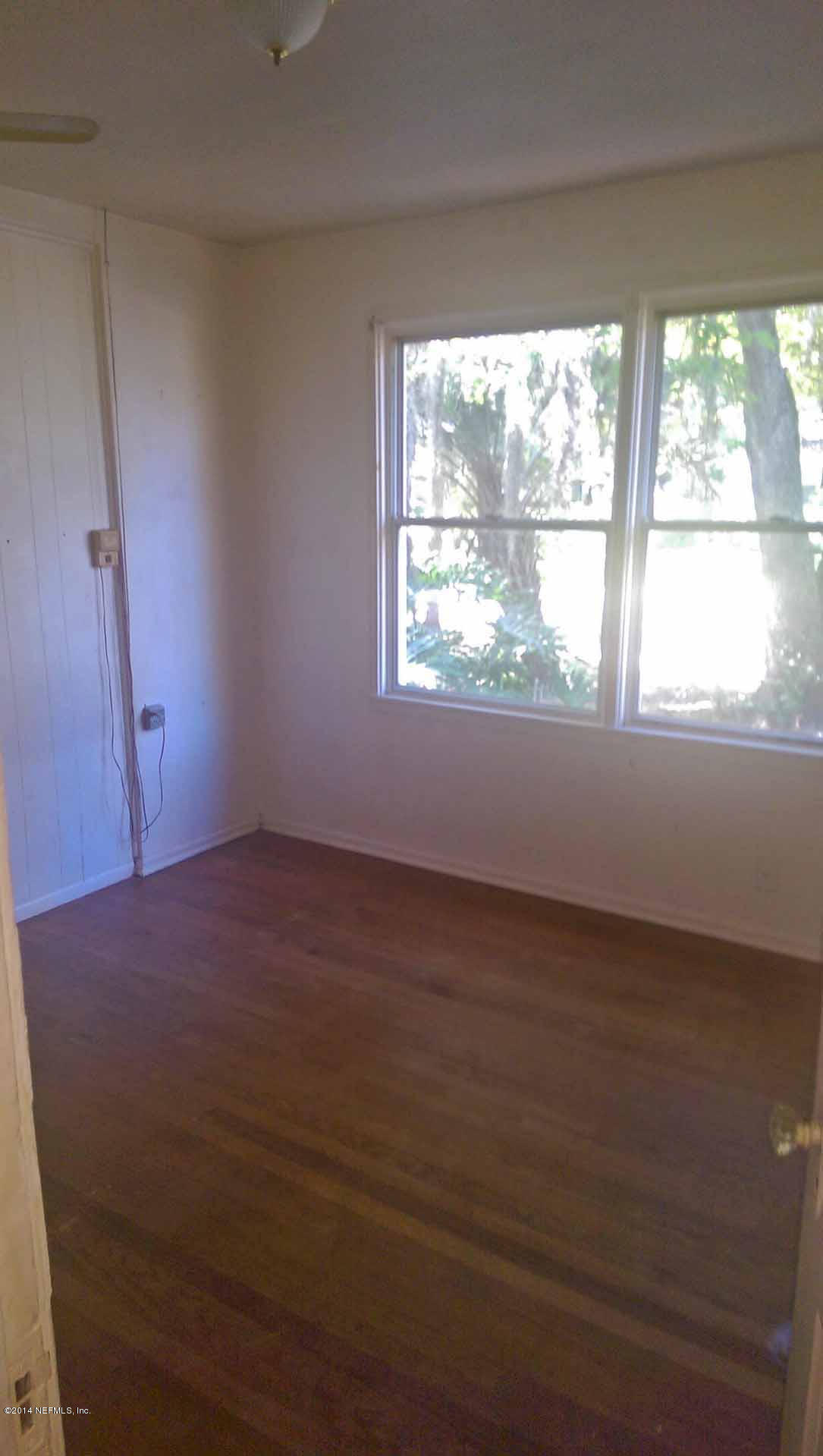 1795 Lilly Road East Jacksonville, FL 32207 - Photo 7 of 12 an empty room with a window