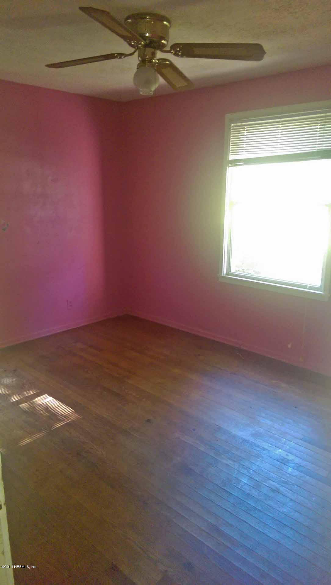 1795 Lilly Road East Jacksonville, FL 32207 - Photo 10 of 12 a view of a room with wooden floor and windows