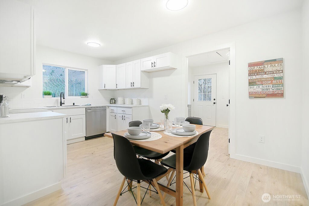 251 Swofford Road Mossyrock, WA 98564 - Photo 17 of 38 a kitchen with a sink dining table and chairs
