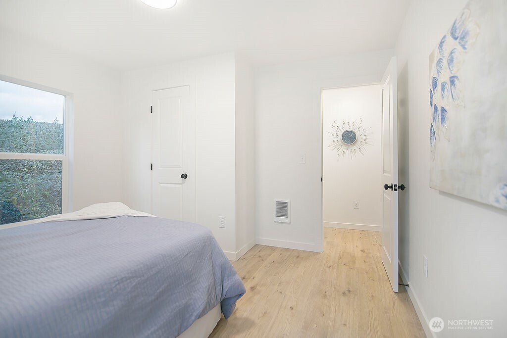 251 Swofford Road Mossyrock, WA 98564 - Photo 21 of 38 a bedroom with a bed and a painting on the wall