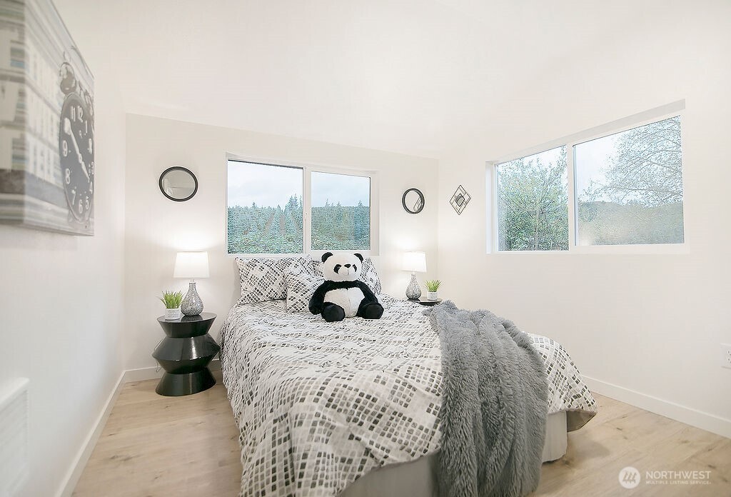 251 Swofford Road Mossyrock, WA 98564 - Photo 22 of 38 a bedroom with a bed and wooden floor