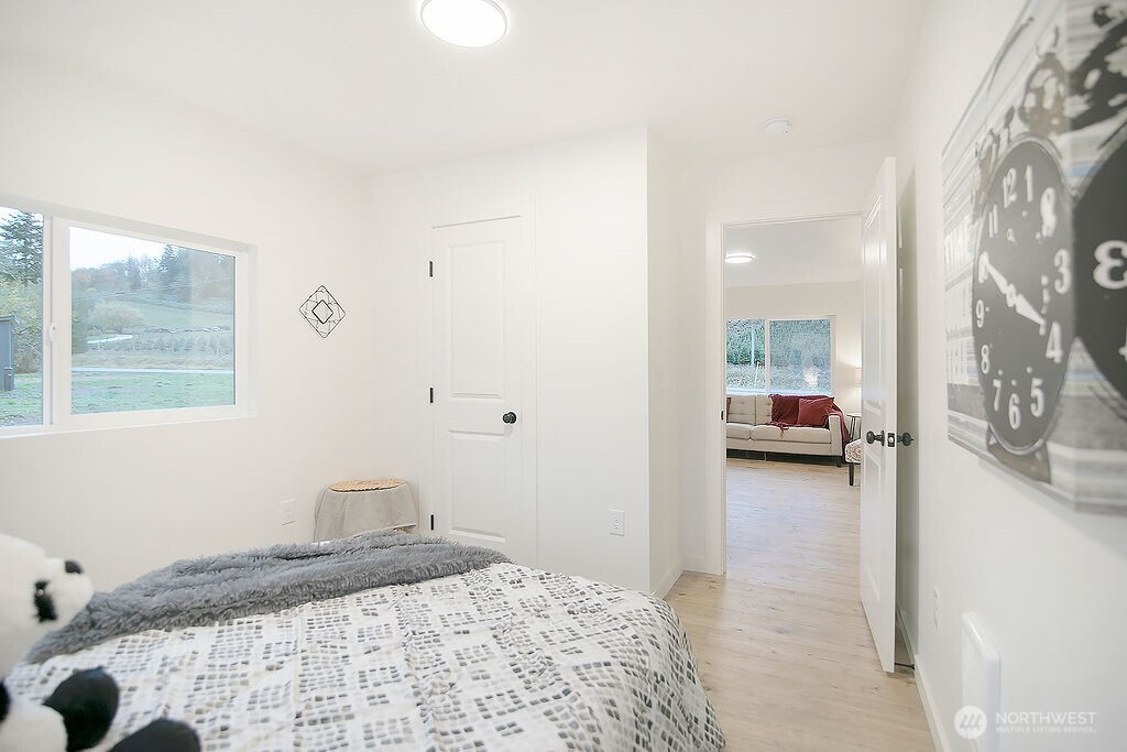 251 Swofford Road Mossyrock, WA 98564 - Photo 24 of 38 a bedroom with a bed and a mirror