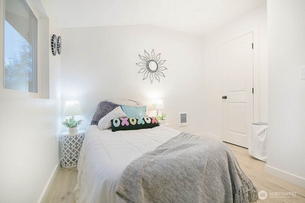 251 Swofford Road Mossyrock, WA 98564 - Photo 26 of 38 a bedroom with a bed and a painting on the wall