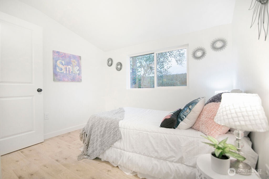 251 Swofford Road Mossyrock, WA 98564 - Photo 27 of 38 a bedroom with a bed and painting on the wall