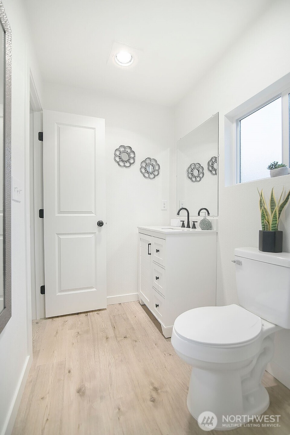 251 Swofford Road Mossyrock, WA 98564 - Photo 29 of 38 a bathroom with a toilet a sink and a window