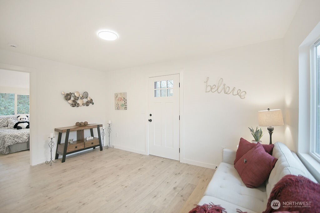 251 Swofford Road Mossyrock, WA 98564 - Photo 4 of 38 a bedroom with a bed and a couch