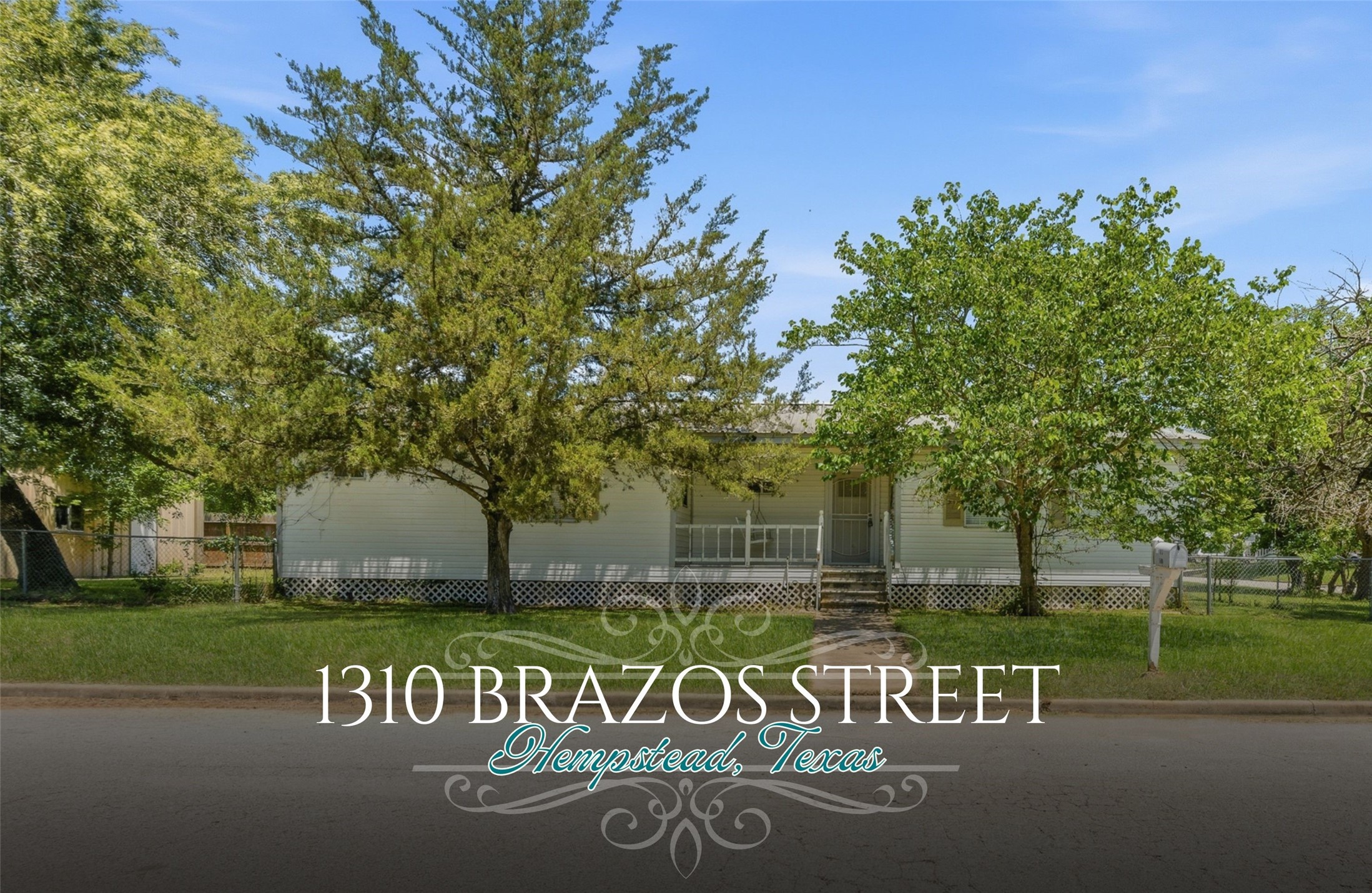1310 Brazos Street Hempstead, TX 77445 - Photo 1 of 32 a sign that is on the side of the road