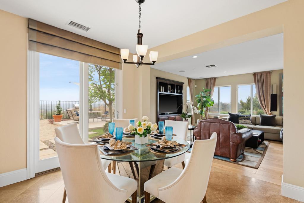 2541 Muirfields Drive Carlsbad, CA 92009 - Photo 12 of 58 a view of a dining room with furniture window and outside view