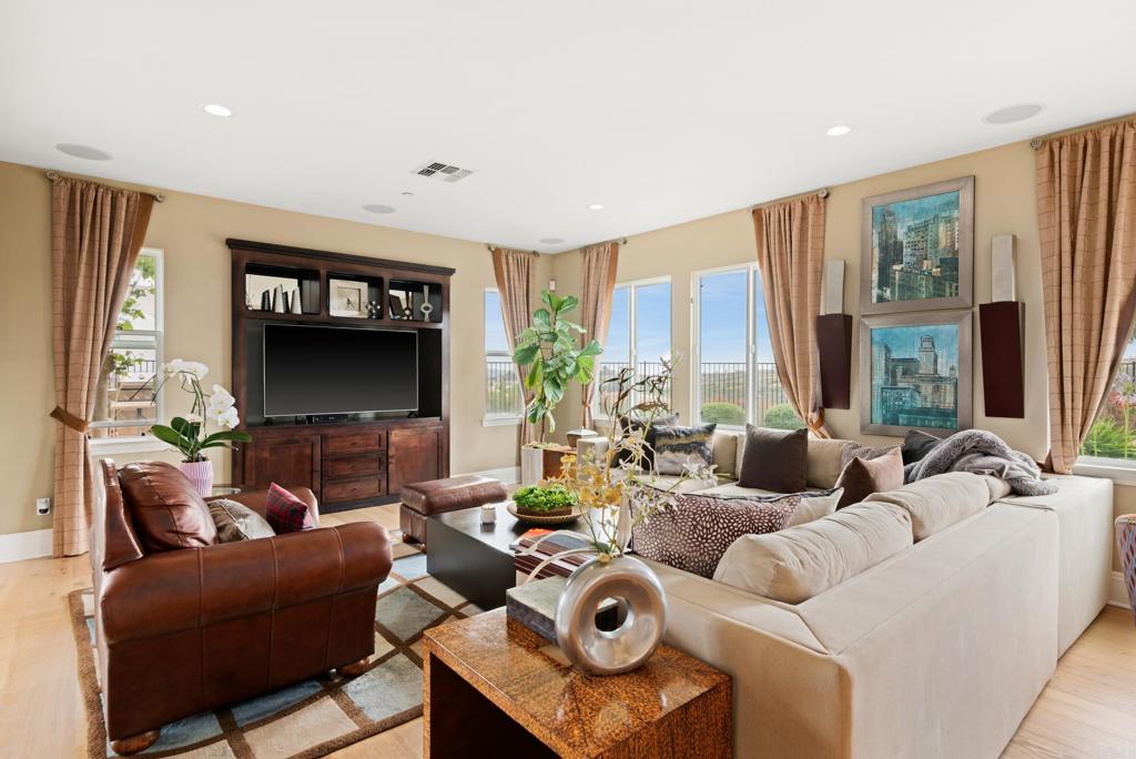 2541 Muirfields Drive Carlsbad, CA 92009 - Photo 16 of 58 a living room with furniture and a flat screen tv