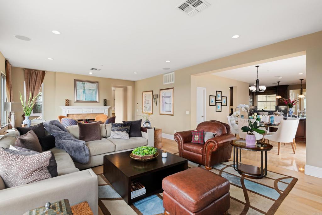2541 Muirfields Drive Carlsbad, CA 92009 - Photo 18 of 58 a living room with furniture and a wooden floor