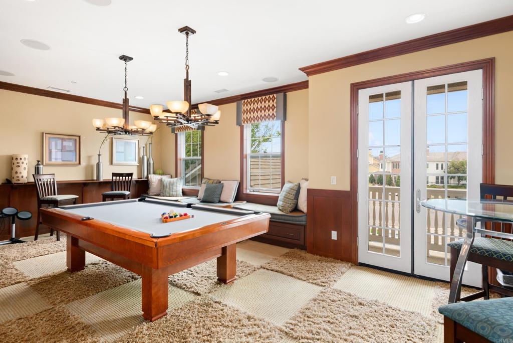 2541 Muirfields Drive Carlsbad, CA 92009 - Photo 25 of 58 a living room with furniture a table and a chandelier