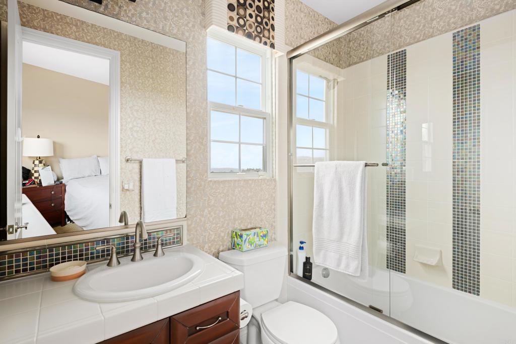 2541 Muirfields Drive Carlsbad, CA 92009 - Photo 30 of 58 a bathroom with a sink double vanity and a mirror