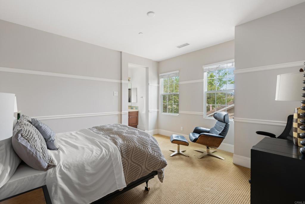 2541 Muirfields Drive Carlsbad, CA 92009 - Photo 31 of 58 a bedroom with a bed and a couch