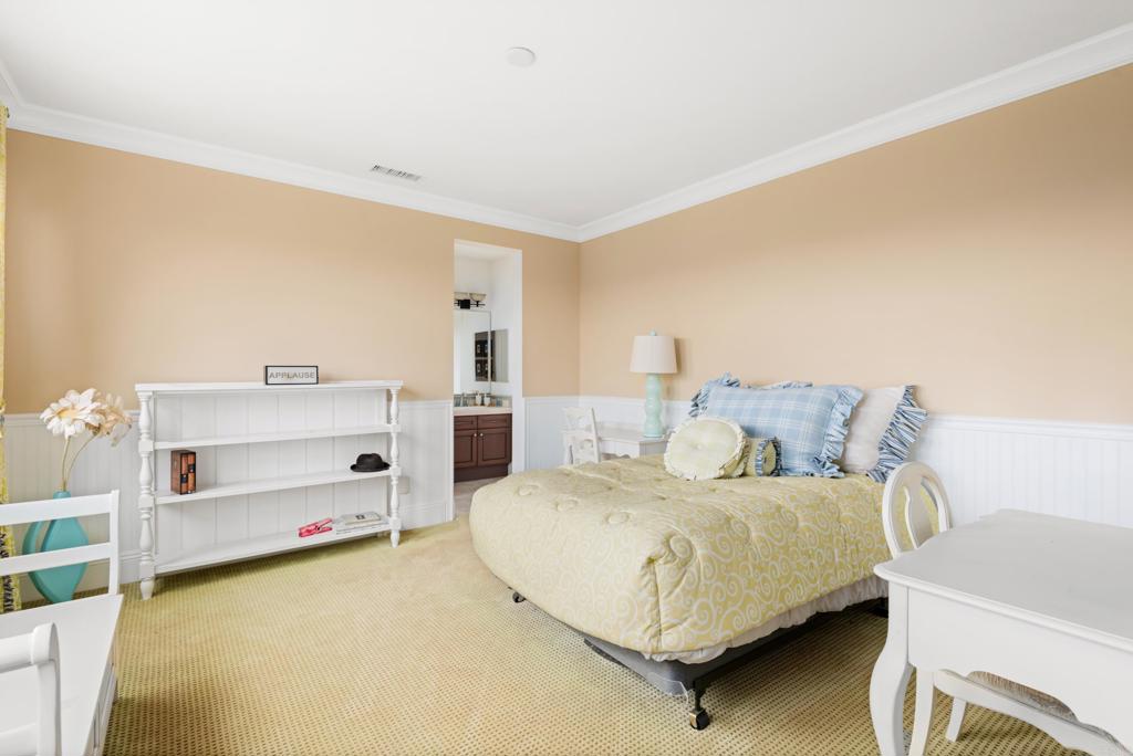 2541 Muirfields Drive Carlsbad, CA 92009 - Photo 33 of 58 a bedroom with a bed and a cabinets