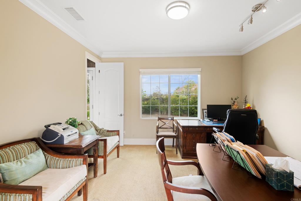 2541 Muirfields Drive Carlsbad, CA 92009 - Photo 37 of 58 a living room with furniture and a floor to ceiling window