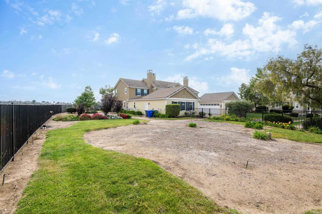 2541 Muirfields Drive Carlsbad, CA 92009 - Photo 41 of 58 a view of house with outdoor space and sitting area