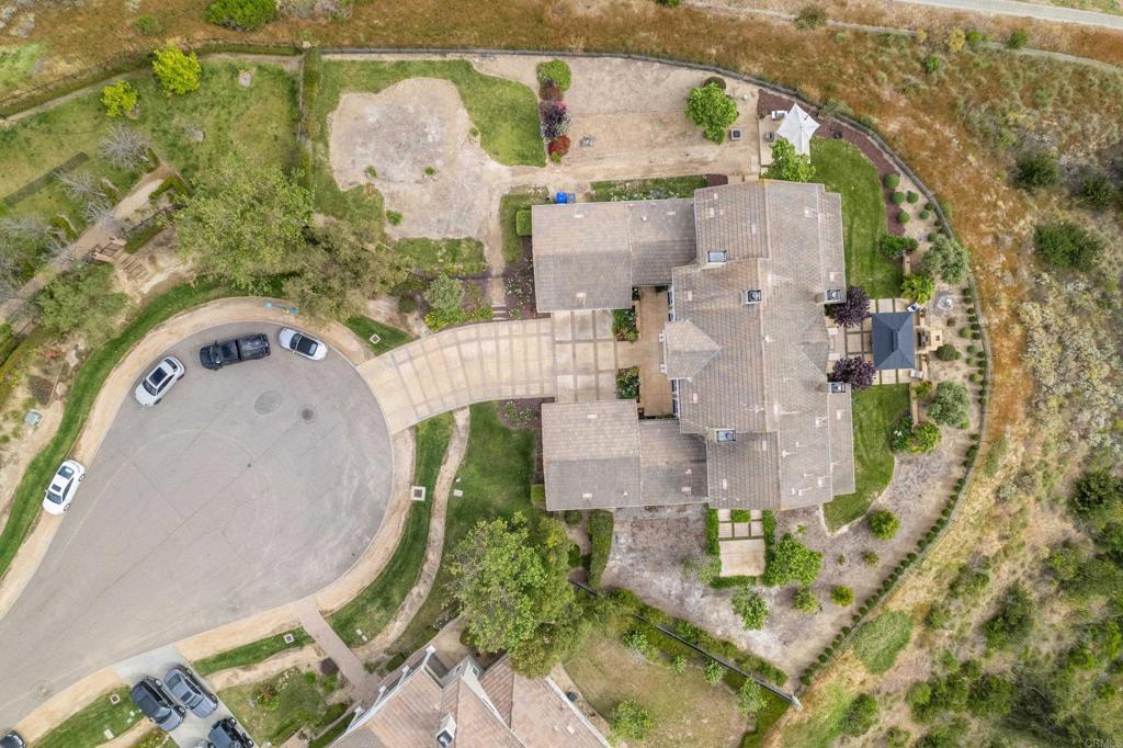 2541 Muirfields Drive Carlsbad, CA 92009 - Photo 49 of 58 an aerial view of a house with outdoor space and a lake view