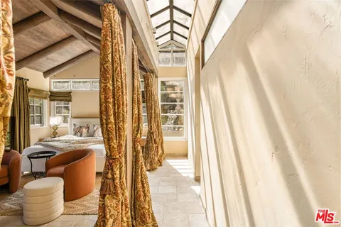 a bathroom with a tub and shower
