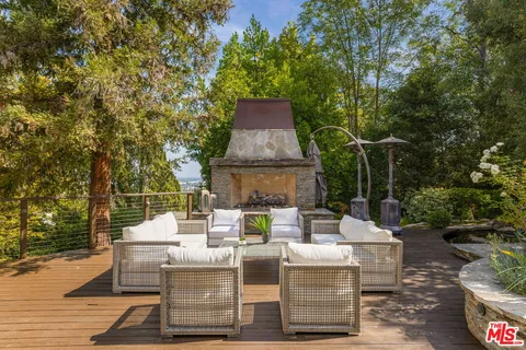 a view of backyard with sitting area
