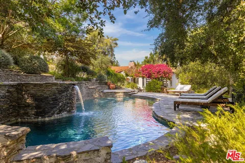 a view of a swimming pool with a patio
