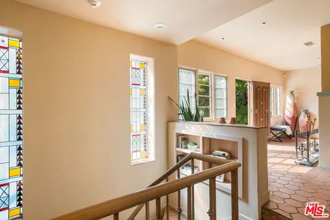 a view of an entryway with wooden floor