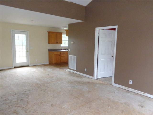 6142 Owens Chapel Road Springfield, TN 37172 - Photo 3 of 16 an empty room with windows and cabinet