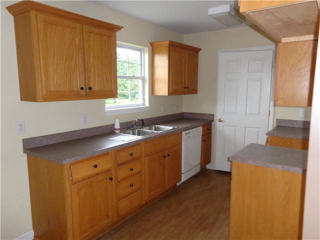 6142 Owens Chapel Road Springfield, TN 37172 - Photo 8 of 16 a kitchen with sink and cabinets