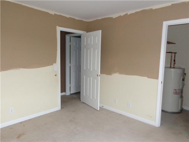 6142 Owens Chapel Road Springfield, TN 37172 - Photo 10 of 16 a view of a hallway with a refrigerator