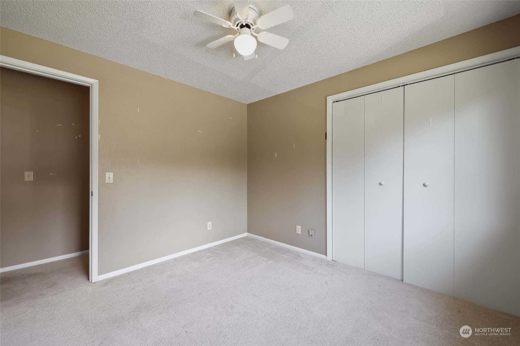 13835 17th Avenue Southwest Burien, WA 98166 - Photo 12 of 33 a view of an empty room with a ceiling fan