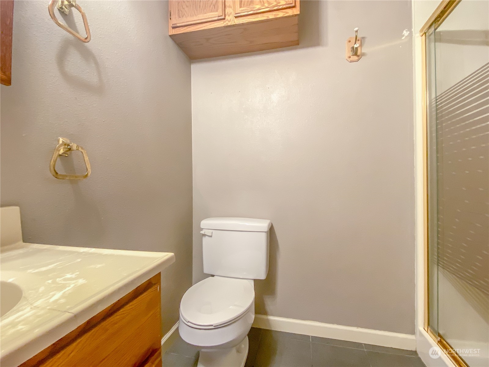 13835 17th Avenue Southwest Burien, WA 98166 - Photo 27 of 33 a bathroom with a toilet and a shower