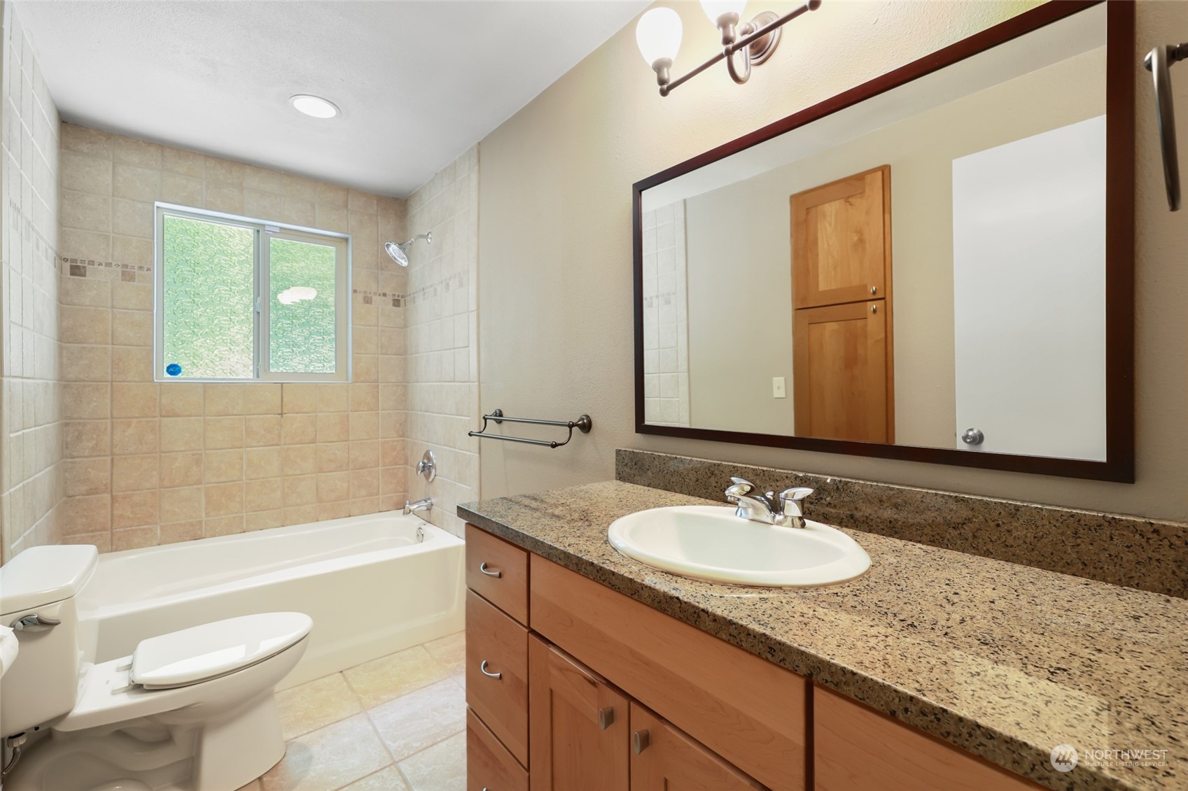 13835 17th Avenue Southwest Burien, WA 98166 - Photo 10 of 33 a bathroom with a granite countertop sink toilet and shower