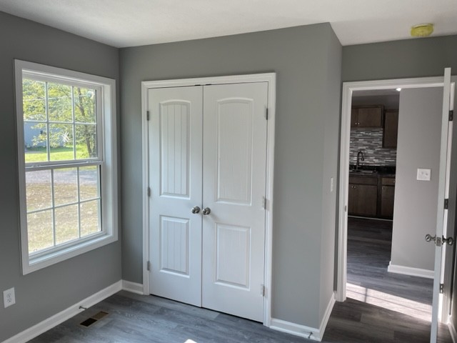 354 Riddle Lane Estill Springs, TN 37330 - Photo 5 of 7 a view of entryway with window and wooden floor