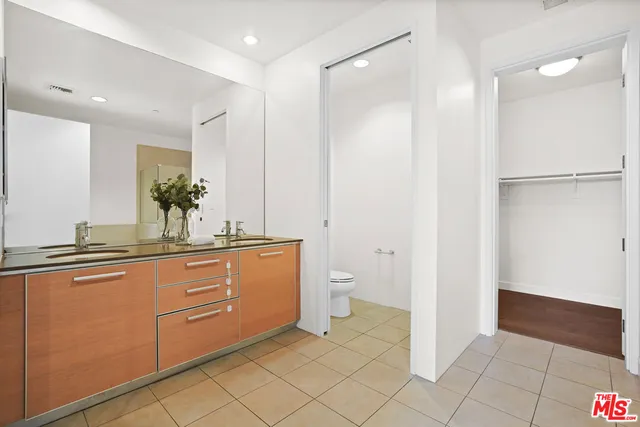 a spacious bathroom with a shower and a sink