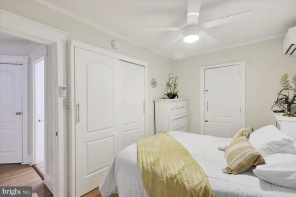 a bedroom with a bed and a closet
