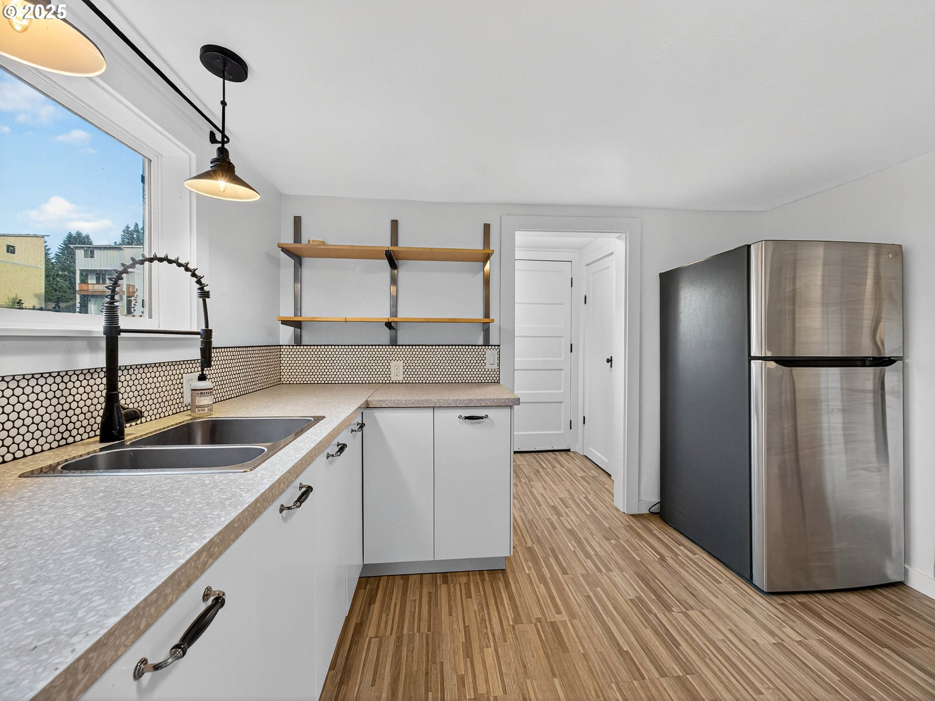900 Southwest Sadie B Avenue Cascade Locks, OR 97014 - Photo 11 of 29 a kitchen with stainless steel appliances granite countertop a refrigerator and a sink