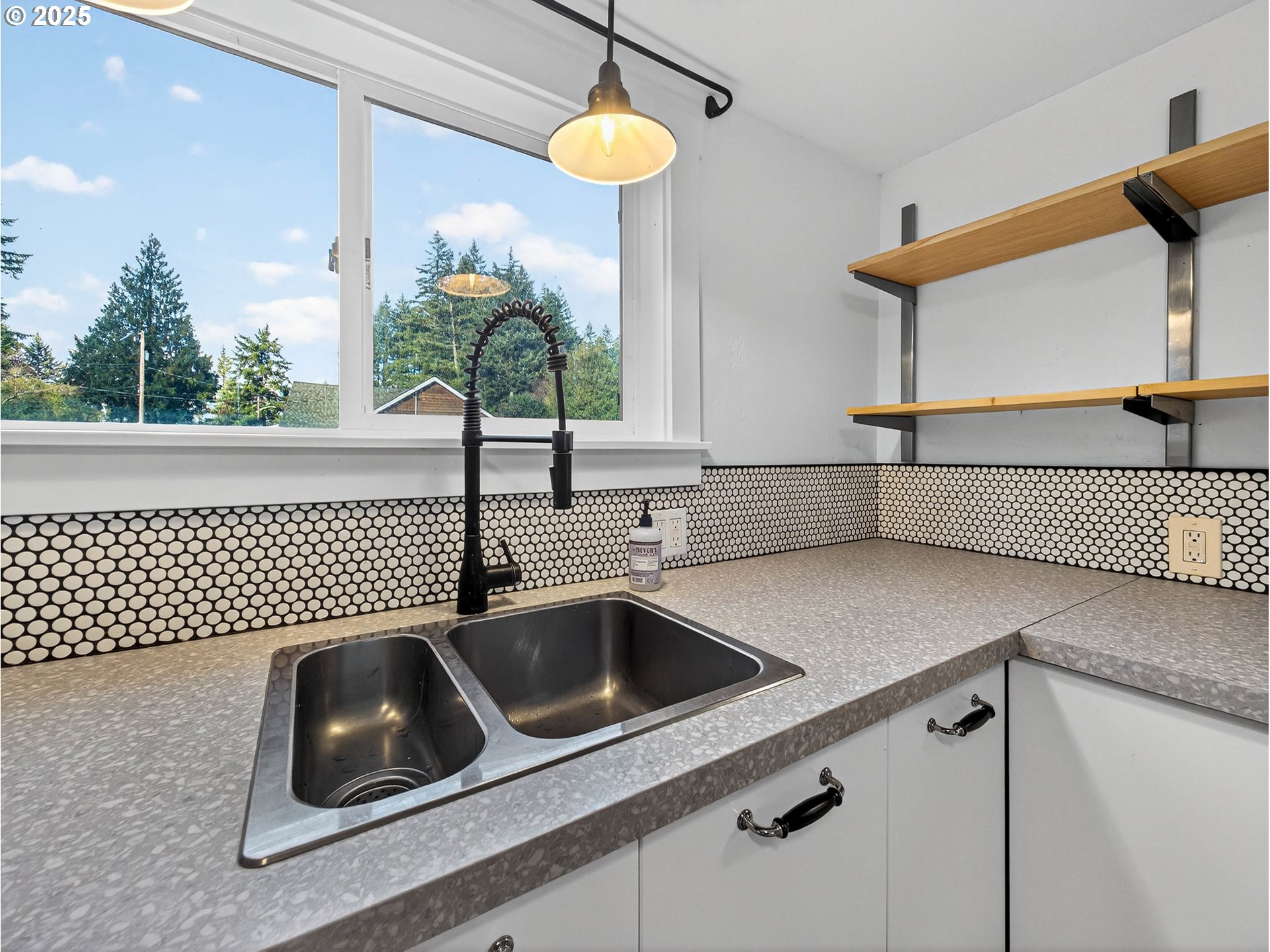 900 Southwest Sadie B Avenue Cascade Locks, OR 97014 - Photo 12 of 29 a kitchen with a sink a counter space and cabinets