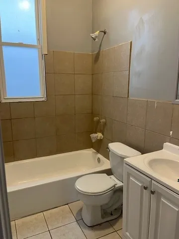 a bathroom with a toilet a sink and bathtub