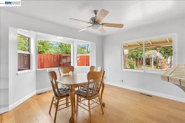a living room with fireplace furniture and a wooden floor