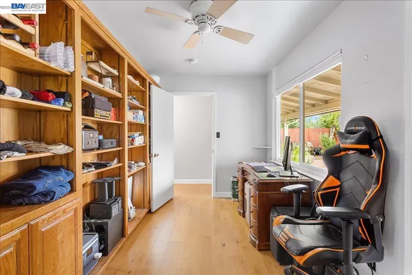 a room that has a bed and a table in it