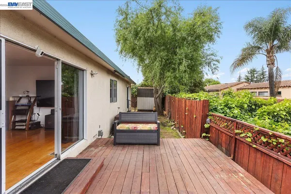 a view of a house with sitting area and garden