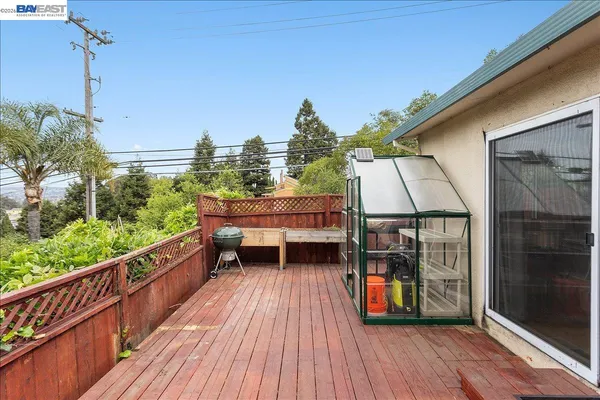 a view of a house with a porch and a garden