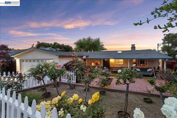 a view of balcony with wooden floor and fence