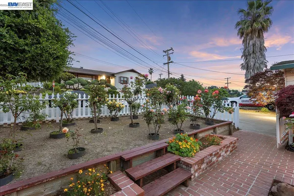 an aerial view of a house with a garden