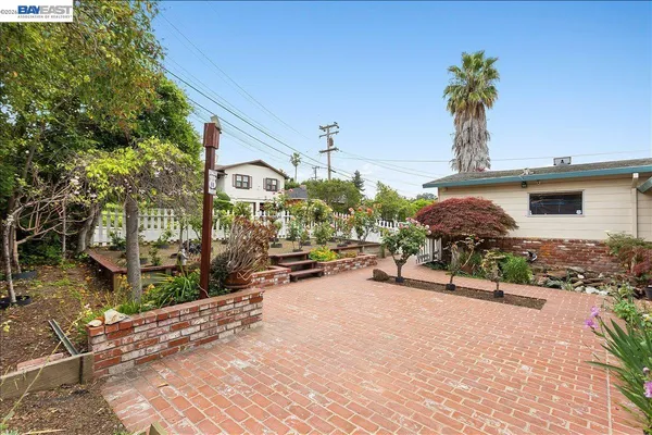a view of an empty room with closet and wooden door