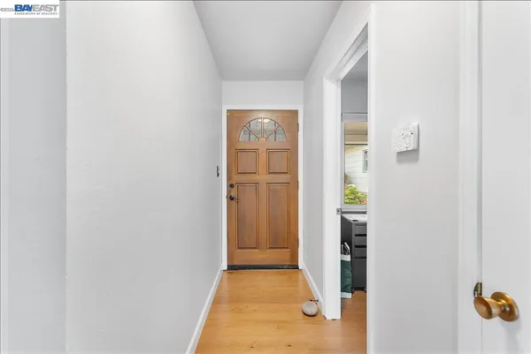 a living room with fireplace furniture and a floor to ceiling window