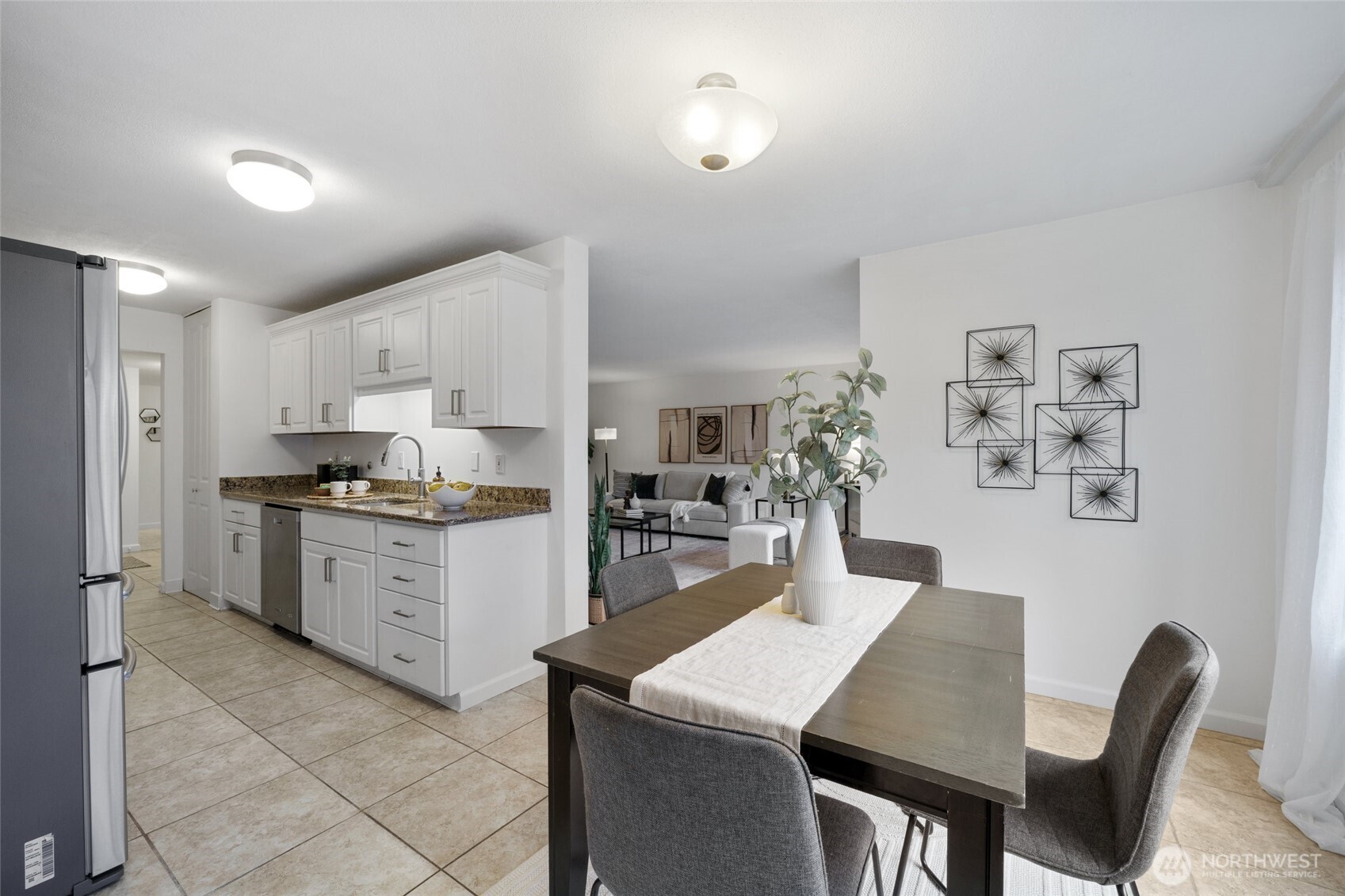 4545 Sand Point Way Northeast, Unit 203 Seattle, WA 98105 - Photo 11 of 28 a kitchen that has a lot of cabinets in it with granite countertop stainless steel appliances cabinets