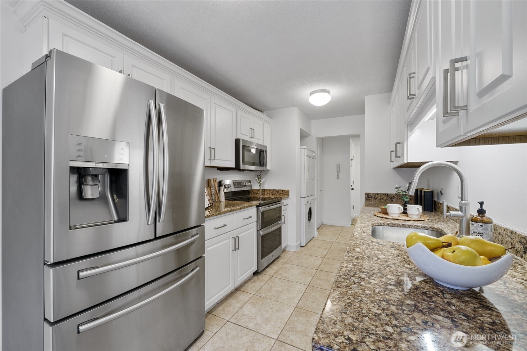 4545 Sand Point Way Northeast, Unit 203 Seattle, WA 98105 - Photo 12 of 28 a kitchen with stainless steel appliances granite countertop a sink a stove and a refrigerator