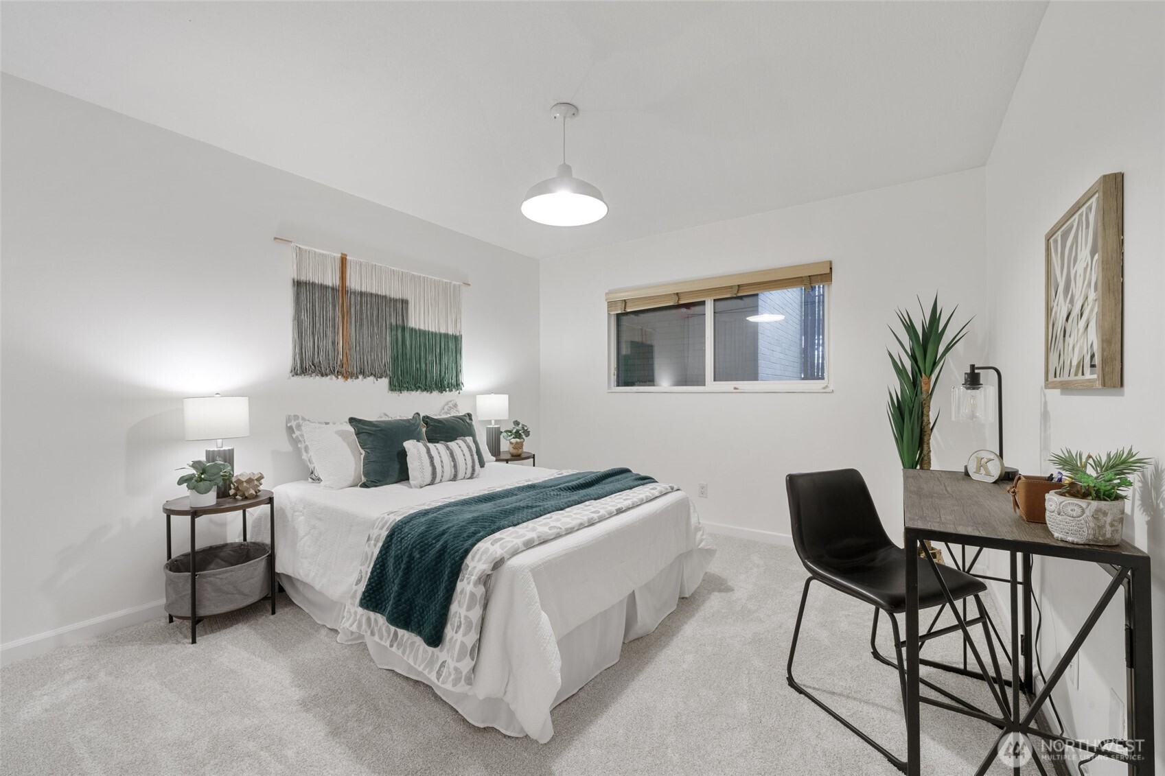 4545 Sand Point Way Northeast, Unit 203 Seattle, WA 98105 - Photo 16 of 28 a bedroom with a bed and a chandelier