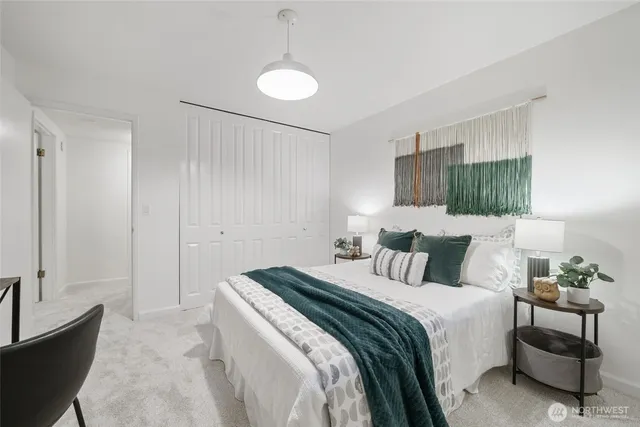 a bedroom with a bed and a couch